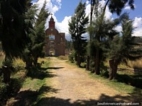 With snow-capped mountains behind, the church replica at Campo Santo, Yungay. Peru, South America.