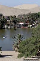 A huge sand crater and watery oasis at Huacachina. Peru, South America.