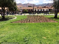 The green grassy Plaza de Armas in Cusco, big and spacious.