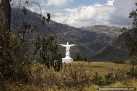 Jesus statue stands overlooking the valley in Kishuara, between Andahuaylas and Abancay. Peru, South America.
