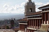 Towers and tiled roofs, the skyline in Ayacucho. Peru, South America.