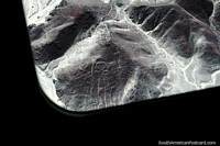Larger version of The Astronaut on a hillside at the Nazca Lines, view from the plane.