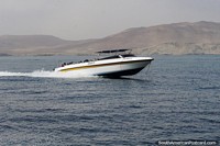 Passenger speed boat takes a group of people out to Islas Ballestas in Paracas. Peru, South America.