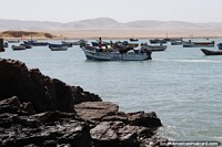 Peru Photo - The fishing village with boats moored at Paracas National Park.