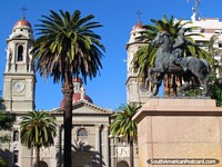 Cathedral, monument and palm trees at Plaza Independencia in Mercedes.