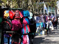Clothing stalls beside a park in Montevideo.
