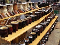 Mugs and cow hooves for drinking mate tea at the Sunday markets, Montevideo. Uruguay, South America.