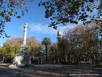 The beautiful and leafy plaza principal in Durazno with monument to Cristobal Colon 1892. Uruguay, South America.