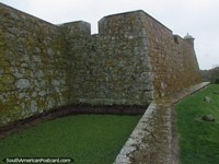 Larger version of Outside stone wall and moat at Fort San Miguel in Chuy.