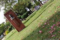 Plaza Risso Canyasso in Fray Bentos, a grassy plaza with trees and flowers. Uruguay, South America.