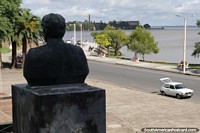 Florencio Sanchez (1875-1910), Uruguayan playwright, founding father of theatre, bust looks out to the river in Fray Bentos. Uruguay, South America.