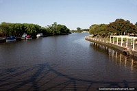 Morning sunlight at the river in Carmelo and the shadow of the Giratorio bridge. Uruguay, South America.