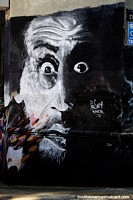Man looks shocked and surprised, a work of street art in Montevideo.