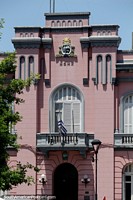 Pink police headquarters in an historic building at the plaza in Maldonado.