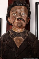 Bow mask, very old mask of a man with mustache, a strange antique at Mazzoni Museum, Maldonado. Uruguay, South America.