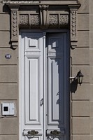 Long, tall and white, the doors of Rocha, nice stone design at the top. Uruguay, South America.