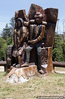 Plaza los Mochileros (Backpackers Plaza), a pair carved out of a tree trunk at Santa Teresa National Park, Punta del Diablo. Uruguay, South America.