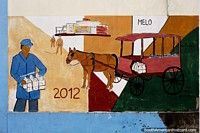 Milk is brought by horse and cart from the factory, street mural in Melo. Uruguay, South America.