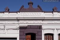Beautiful facade of white and purple in great condition in Melo. Uruguay, South America.