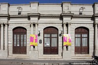 Theater in Melo - Teatro Espana (1914) beside Plaza Independencia, with columns and arched doors. Uruguay, South America.