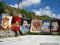 Images of lions and tigers on warm blankets sold in the highlands near Merida. Venezuela, South America.