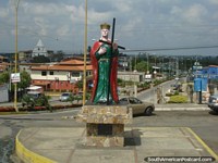 Monument of a green and red virgen Santa Elena in Obispo Ramos de Lora. Venezuela, South America.