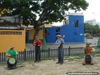 The band plays on, Christmas figures in Puerto Cabello. Venezuela, South America.