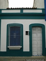 The front of a house with tidy paint job in Puerto Cabello. Venezuela, South America.
