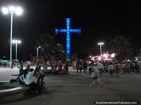 Eastern end of Paseo Colon with huge cross that changes color, where locals enjoy skating, relaxing and fun, Puerto La Cruz. Venezuela, South America.