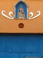 A religious idol on the facade of a house in Carora. Venezuela, South America.