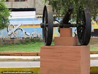 A real cannon and a mural of 2 cannon, view from Plaza Independencia in Carora. Venezuela, South America.