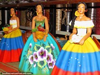 Female figures in colorful dresses to put on the shelf in an El Tintorero shop. Venezuela, South America.