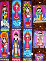 Colorful religious figures wall pictures, souvenir shop, Colonia Tovar. Venezuela, South America.