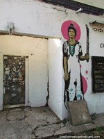 Não quero ser a seguinte pessoa a sair aquela porta, mulher com grafite de machete em Barinas. Venezuela, América do Sul.