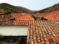 Looking across tiled roofs towards the hills in San Rafael de Mucuchies. Venezuela, South America.