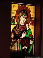 Woman and child with a pair of angels, stained glass window at St. Benedict Chapel in Timotes. Venezuela, South America.