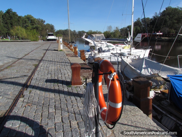 Cobblestone port and boats in Mercedes on the Negro River. (640x480px). Uruguay, South America.