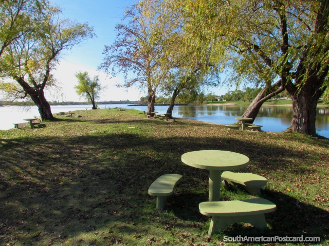 Picnic tables and seats on Port Island at the Negro River in Mercedes. (640x480px). Uruguay, South America.