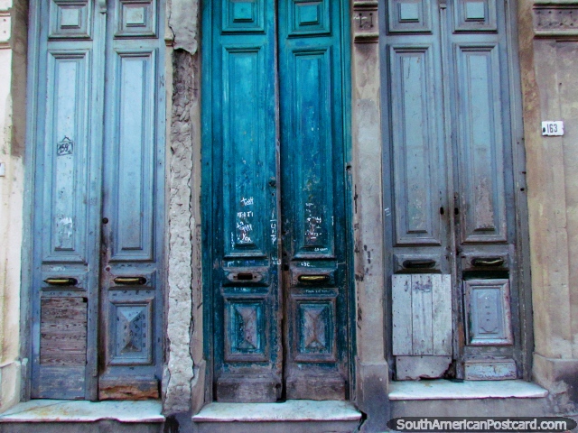 3 old tall wooden doors in the old city in Montevideo. (640x480px). Uruguay, South America.