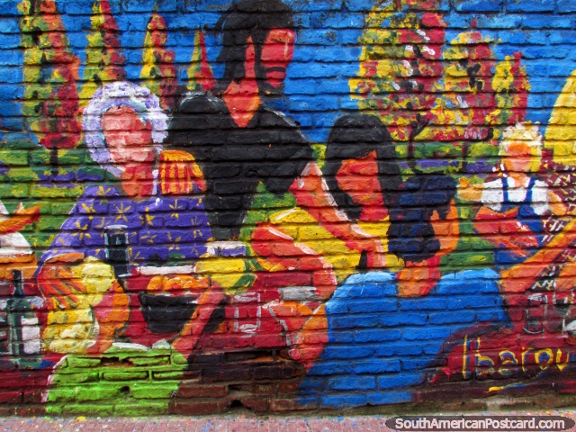 Very colorful graffiti art of a family on a brick wall in Montevideo. (640x480px). Uruguay, South America.