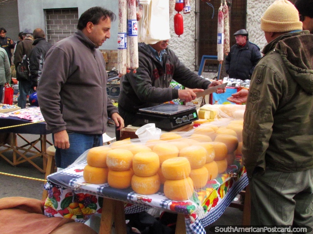 Round blocks of cheese at La Feria Tristan Narvaja markets in Montevideo. (640x480px). Uruguay, South America.