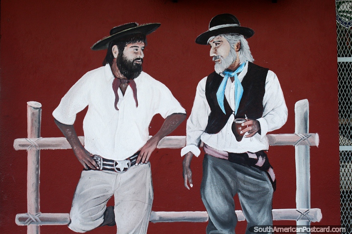 Pair of gauchos, one with mate tea, mural at the Talabarteria Art Shop in Salto. (720x480px). Uruguay, South America.