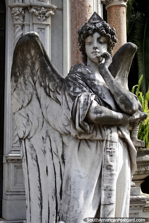 Angel with wings, sculpted stone monument at the old cemetery in Paysandu. (480x720px). Uruguay, South America.