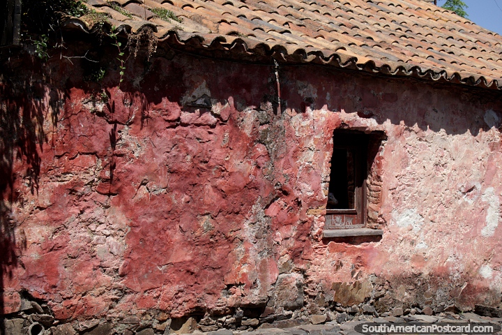 Iconic pink building built by the Portuguese on the Street of Sighs in Colonia. (720x480px). Uruguay, South America.
