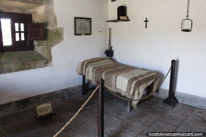 Simple bedroom with bed and window at Santa Teresa fortress in Punta del Diablo. (720x480px). Uruguay, South America.