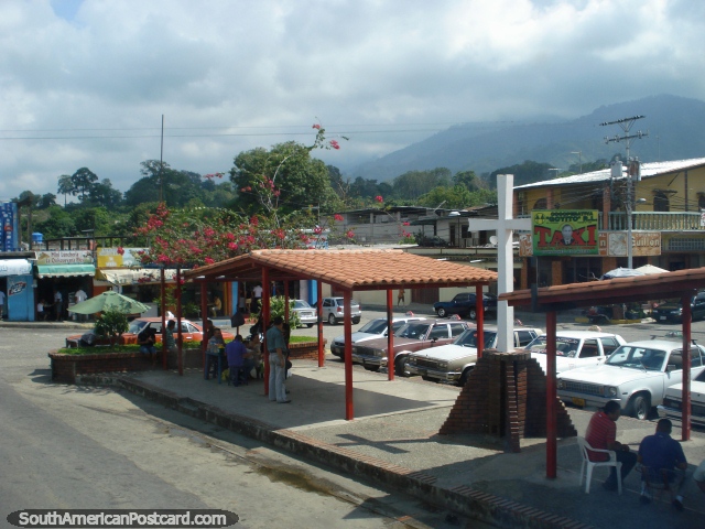 A little town with red flowers between Merida and Maracaibo. (640x480px). Venezuela, South America.