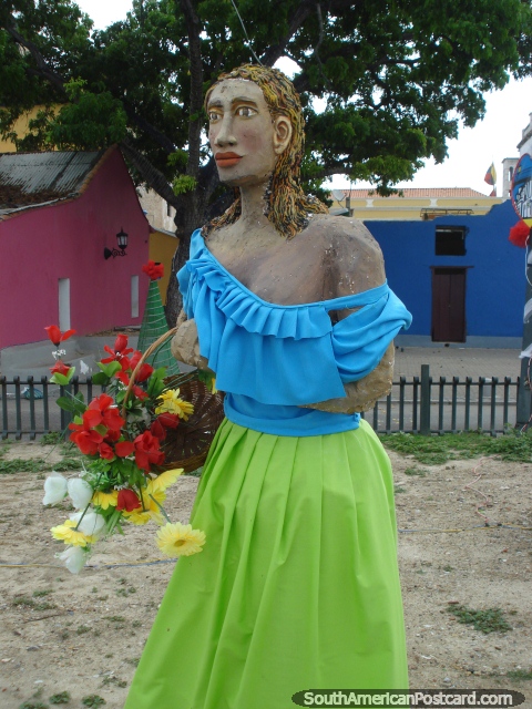 A woman with flowers Christmas figure in Puerto Cabello. (480x640px). Venezuela, South America.