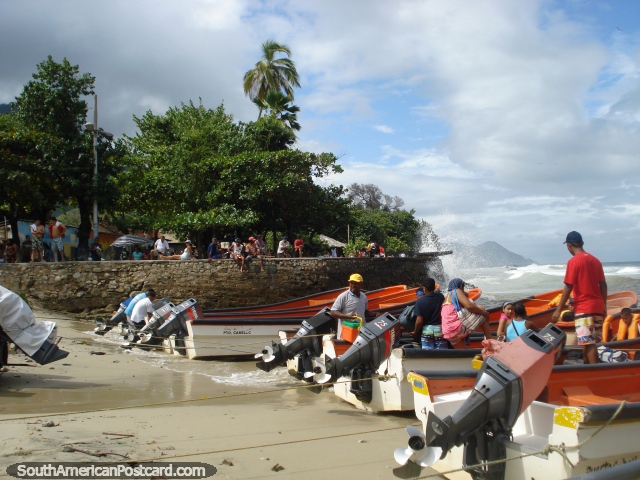 The beach and park behind in the Puerto Colombia township. (640x480px). Venezuela, South America.