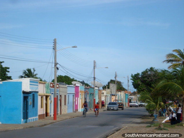 The main street in Boca de Rio with it's colorful houses and palm trees, Isla Margarita. (640x480px). Venezuela, South America.