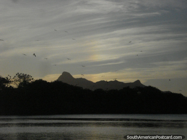 The sun sets at lagoon La Restinga on Isla Margarita with mountains in the background. (640x480px). Venezuela, South America.
